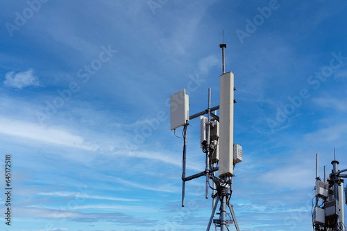 Small Cell 3G, 4G, 5G System. Macro Base Station or Base Transceiver Station on Electricity post. Wireless Communication Antenna Transmitter. Development of communication system in urban area.