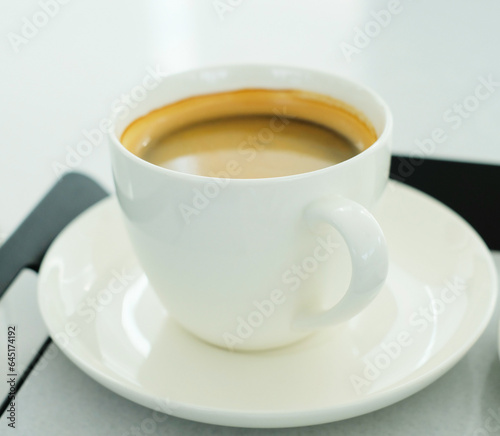 A cup of hot coffee on white background