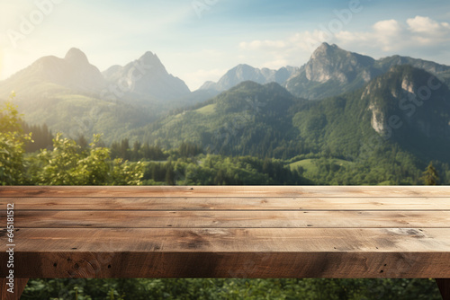 Empty wooden table for product display montages with mountains in the background © Creative