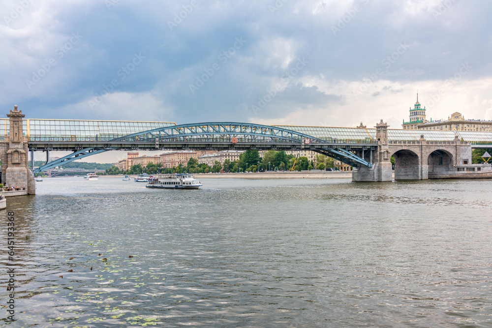 View of the Moscow river embakment, Pushkinsky bridge and cruise ships at sunset. View of the Moscow river embakment, Pushkinsky bridge and cruise ships at sunset.