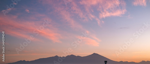 view of Mount Rinjani at sunrise in Lombok, sunrise and mountain view, sunrise in Lombok, sunrise over the mountains, mount Rinjani view in the morning, beautiful sunrise sky and mountain