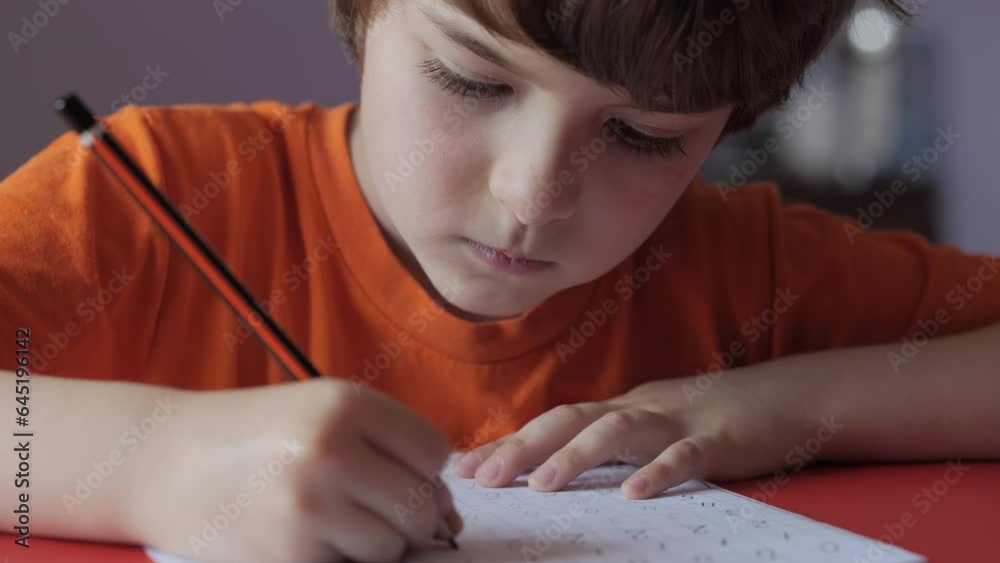 School Boy Practicing Writing Numbers at Home. Child Working on His ...