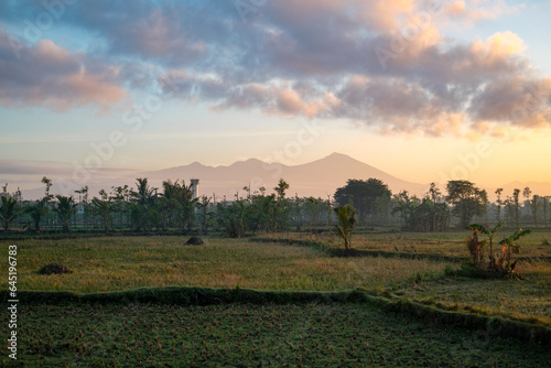 view of Mount Rinjani at sunrise in Lombok, sunrise and mountain view, sunrise in Lombok, sunrise over the mountains, mount Rinjani view in the morning, beautiful sunrise sky and mountain