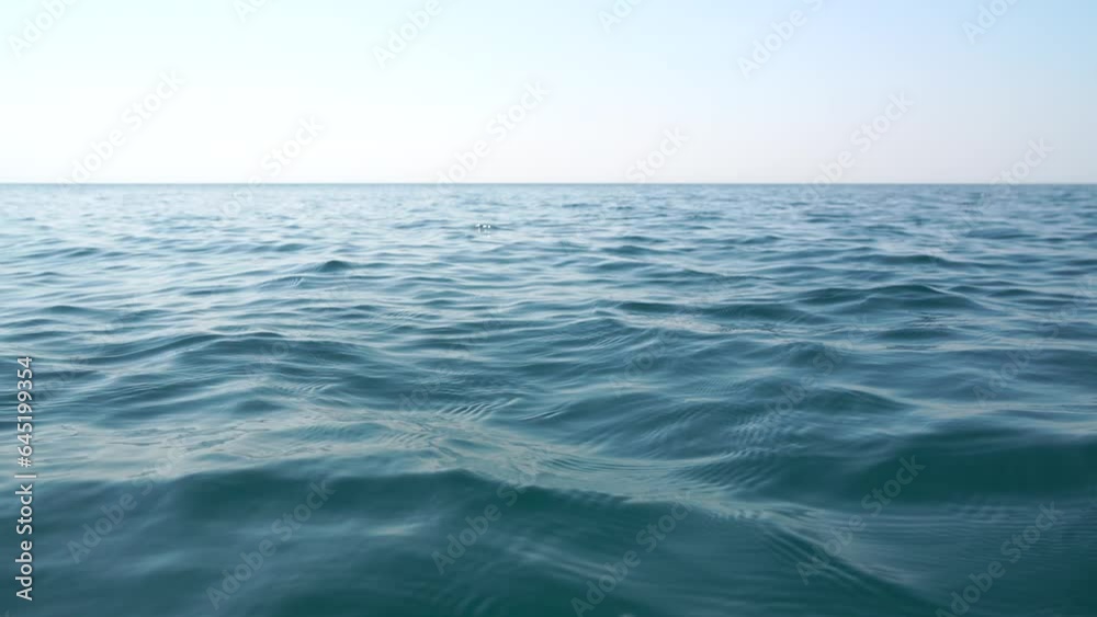 Sea water surface. Camera flies over the calm azure sea. Nobody. Holiday recreation concept. Abstract nautical summer ocean nature. Close up Sea water surface. Camera flies over the calm azure sea. Nobody. Holiday recreation concept. Abstract nautical summer ocean nature. Close up