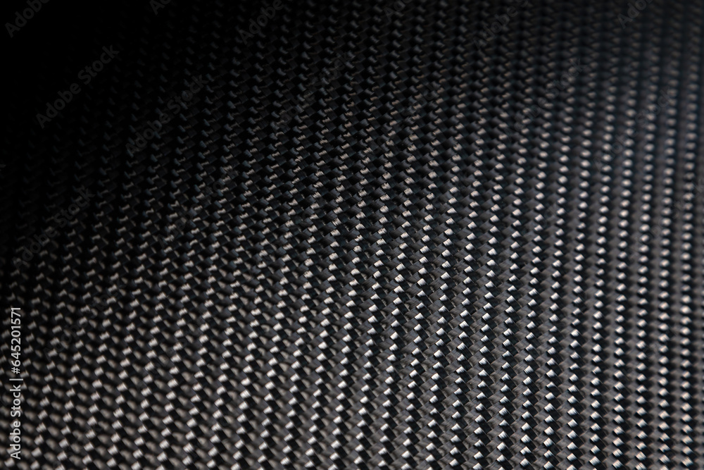 Close-up black car seat trim. Soft rough carbon fabric texture. Close-up black car seat trim. Soft rough carbon fabric texture.