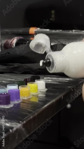 Tattoo artist makes a tattoo to a client