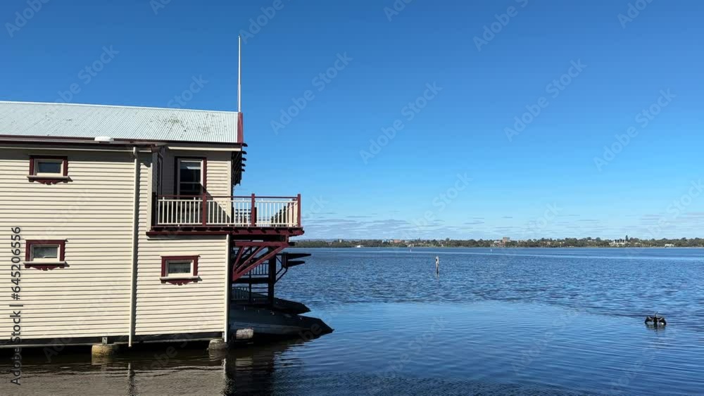 Boat house on the Swan River, Perth, Western Australia. Cormorant shag