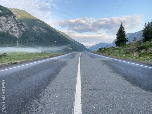Road in the mountains in summer, photo as a background, digital image