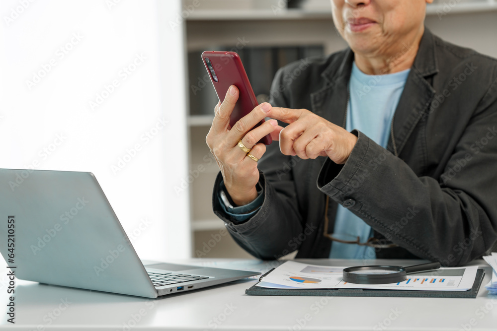 Mature businessman diligently working at his office desk, demonstrating dedication and commitment to his tasks. Experienced executive, Corporate competence, Executive commitment, Business maturity Mature businessman diligently working at his office desk, demonstrating dedication and commitment to his tasks. Experienced executive, Corporate competence, Executive commitment, Business maturity