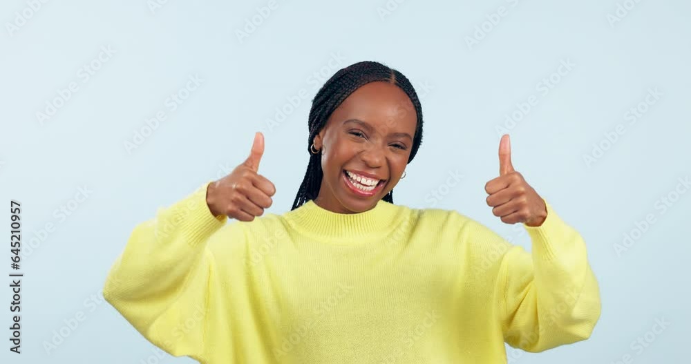 Happy black woman, good news and thumbs up in success or winning against a studio background. Portrait of excited African female person with like emoji, yes sign or OK in approval or agree on mockup Happy black woman, good news and thumbs up in success or winning against a studio background. Portrait of excited African female person with like emoji, yes sign or OK in approval or agree on mockup