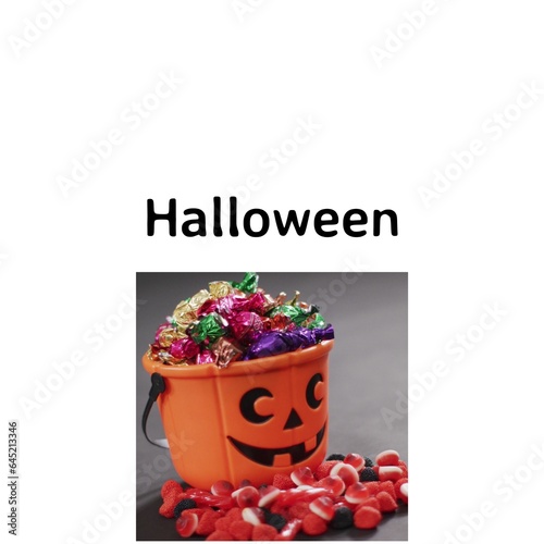 Composite of halloween text and halloween pumpkin with sweets on white background