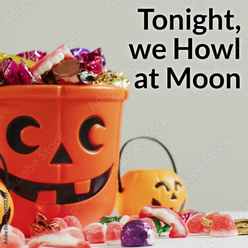 Composite of tonight, we howl at moon text and halloween pumpkins bucket and sweets