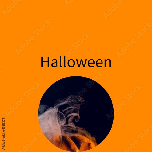 Composite of halloween text and smoke on orange background
