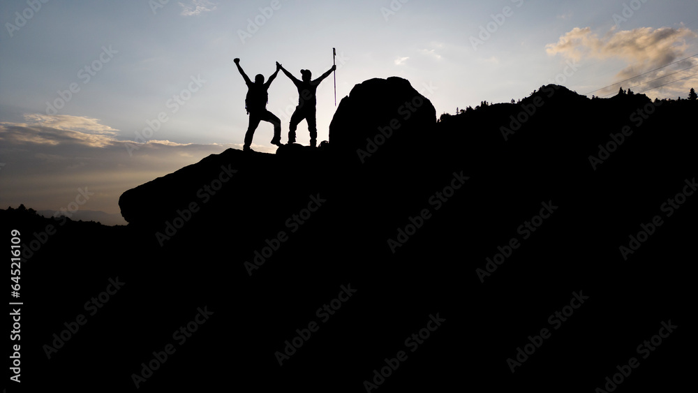 Rhythm of Nature: The Harmonious Dance of Two Mountaineers at the Top Rhythm of Nature: The Harmonious Dance of Two Mountaineers at the Top
