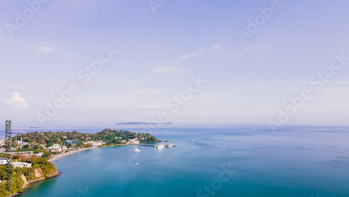 Aerial view of blue water surface background and sun reflection. aerial view of a flying drone Waves surface on a tropical ocean with bright sunlight. Perfect for vacations, © Stock.Foto.Touch
