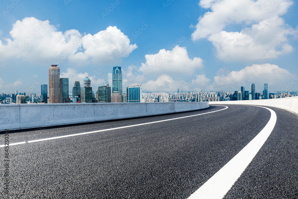 Asphalt highway and urban skyline with modern buildings in Chongqing, Sichuan Province, China.