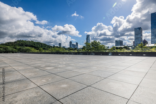 Empty square floor and skyline with modern buildings background