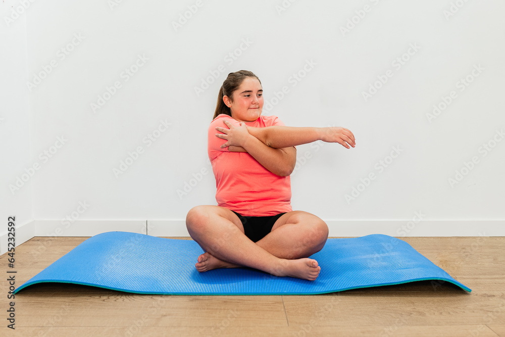 Teenager does yoga exercises at home Teenager does yoga exercises at home