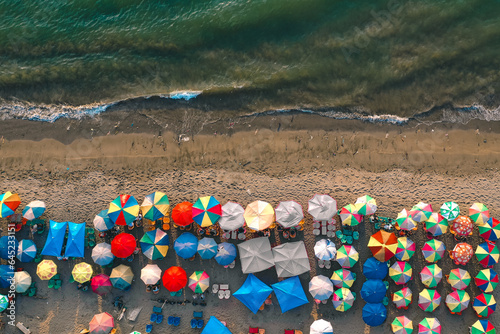 aerial view of colorful umbrellas on Taplau beach in Padang City, West Sumatra photo