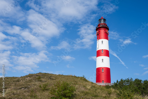 Nordseeinsel Amrum  in den D  nen der Leuchtturm vor blauem Himmel