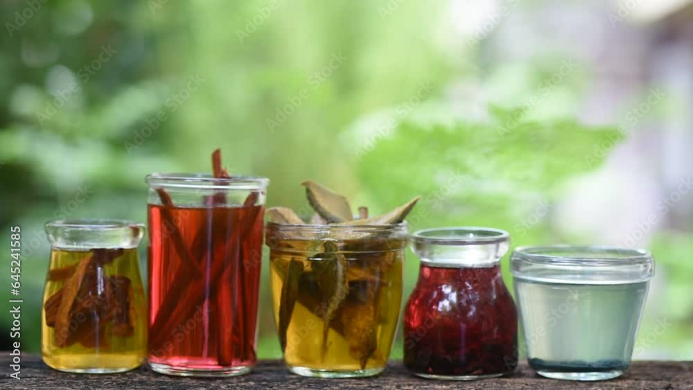 Colorful water dyes clothes extracted from herbs with water on nature background. Colorful water dyes clothes extracted from herbs with water on nature background.