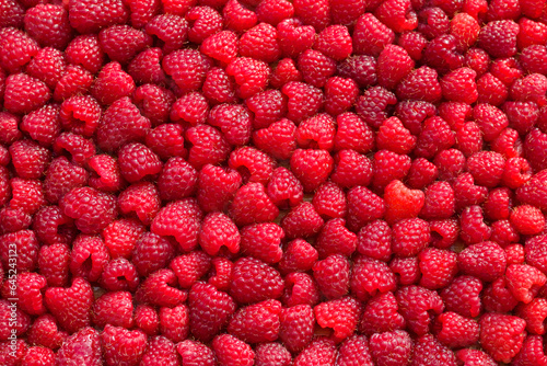  Sweet red raspberries. Juicy raspberries on the table.