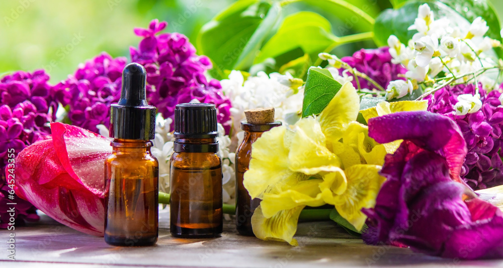Essential oil extract of herbs and flowers. Selective focus Essential oil extract of herbs and flowers. Selective focus