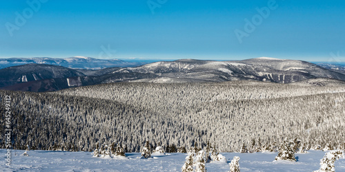 Westernmost part of Jeseniky mountains with Keprnik hill, Kralicky Sneznik and Krkonose mountains on the background from Praded hill during winter photo