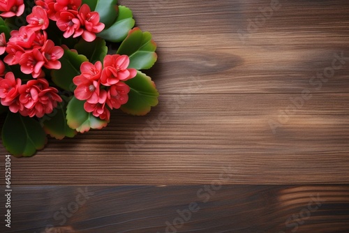 A wooden background featuring a kalanchoe flower and heart. Generative AI