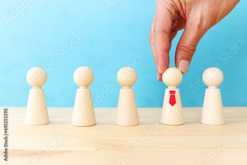 business image of wooden figures  human resources  leadership  and management concept