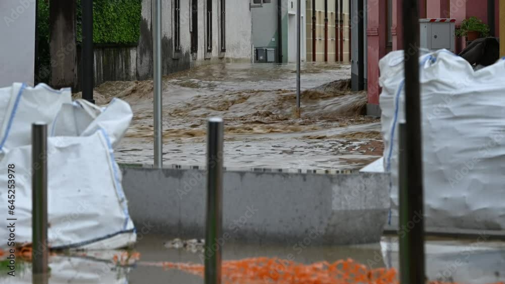 Floods in the city streets after heavy rain. Severe weather disaster. Floods in the city streets after heavy rain. Severe weather disaster.