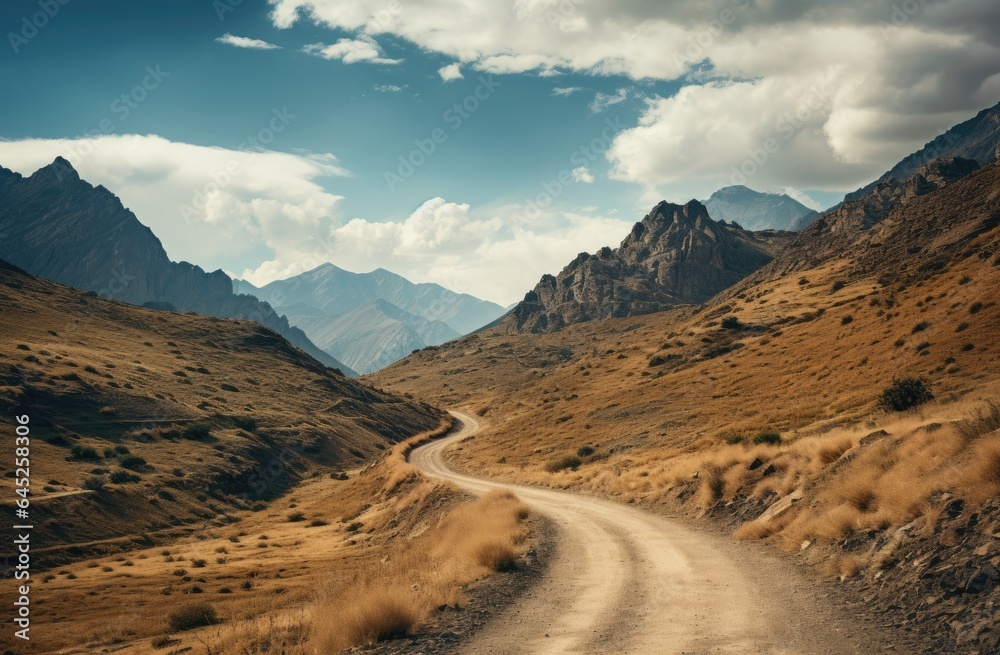 Winding Dirt Road Along a Cloudy Mountain Landscape - Generative AI