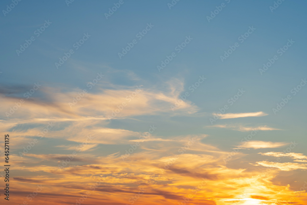 summer evening, sunset in yellow, orange and pink with clouds, background