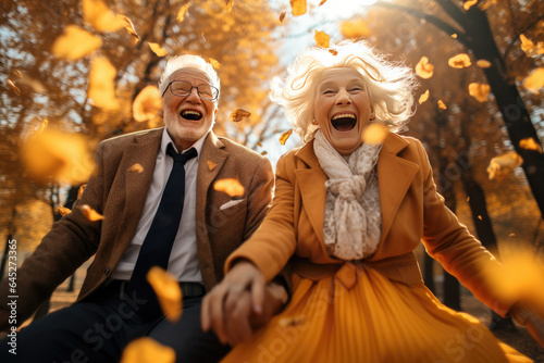 An elderly couple in an autumn park. Generative AI.