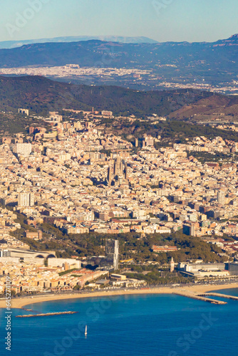 Barcelona city, Spain looked from an airplane view from the sky. Beautiful sunny clear blue sky day. Travel fly concept. High quality photo