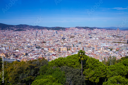 Barcelona city, Spain looked from an airplane view from the sky. Beautiful sunny clear blue sky day. Travel fly concept. High quality photo