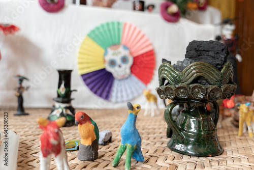 A ceramic copal globet is decorating a Day of the Dead sleeping mat photo