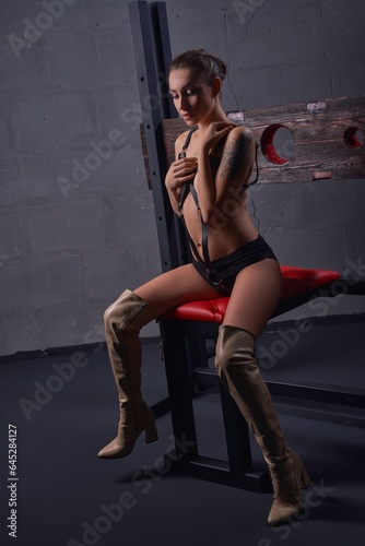 Sexy woman in underwear sitting in studio © Wisky