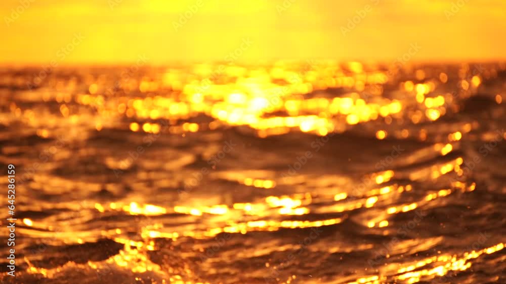 Abstract nautical summer ocean sunset background with blurred waves, sun reflections, and bokeh. Seamless panorama and sky replacement enhance the serene beauty of the golden sea.