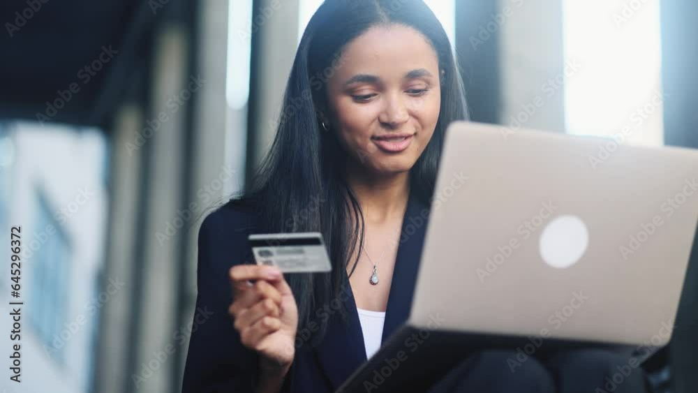 Portrait of charming young businesswoman paying with credit card on laptop at modern urban city Happy customer doing payments online shopping in internet store and receiving cash back outdoors Portrait of charming young businesswoman paying with credit card on laptop at modern urban city Happy customer doing payments online shopping in internet store and receiving cash back outdoors