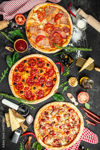 pizza with ham, mushrooms and cheese on a dark background, Fast food lunch. top view. place for text