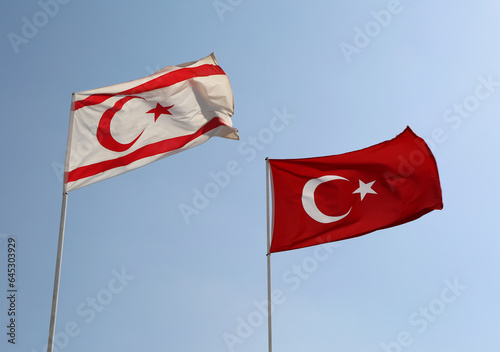 Flags of Turkish Republic of Northern Cyprus and Republic of Turkey flying in the air in Famagusta, North Cyprus