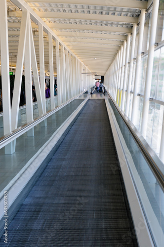 Long travelator moving walkway in an airport.