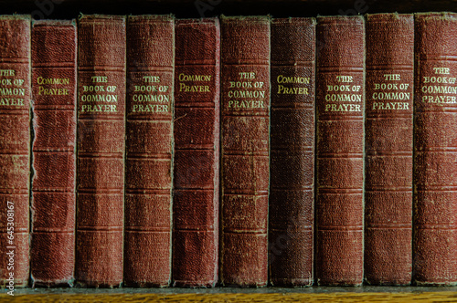 Row of the Book of Common Prayer on a shelf in a church photo