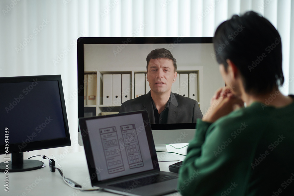 Founder having online meeting with developer, discussing deployed features Founder having online meeting with developer, discussing deployed features