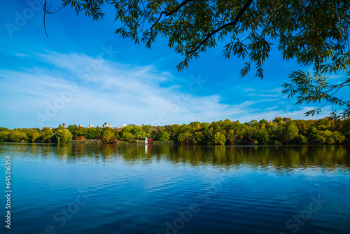 Obraz na płótnie Germany, Stuttgart panorama view colorful trees coast max eyth see lake water autumn season sunset under trees w salonie