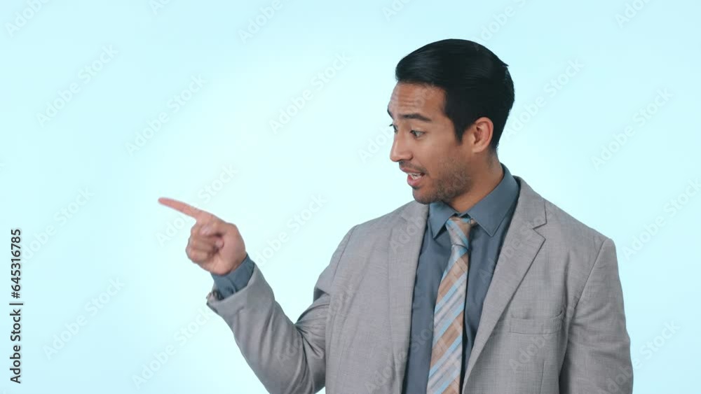 Happy businessman, pointing and list on mockup space for advertising against a studio background. Portrait of asian man or employee with smile and showing business deal, sale or discount in marketing Happy businessman, pointing and list on mockup space for advertising against a studio background. Portrait of asian man or employee with smile and showing business deal, sale or discount in marketing