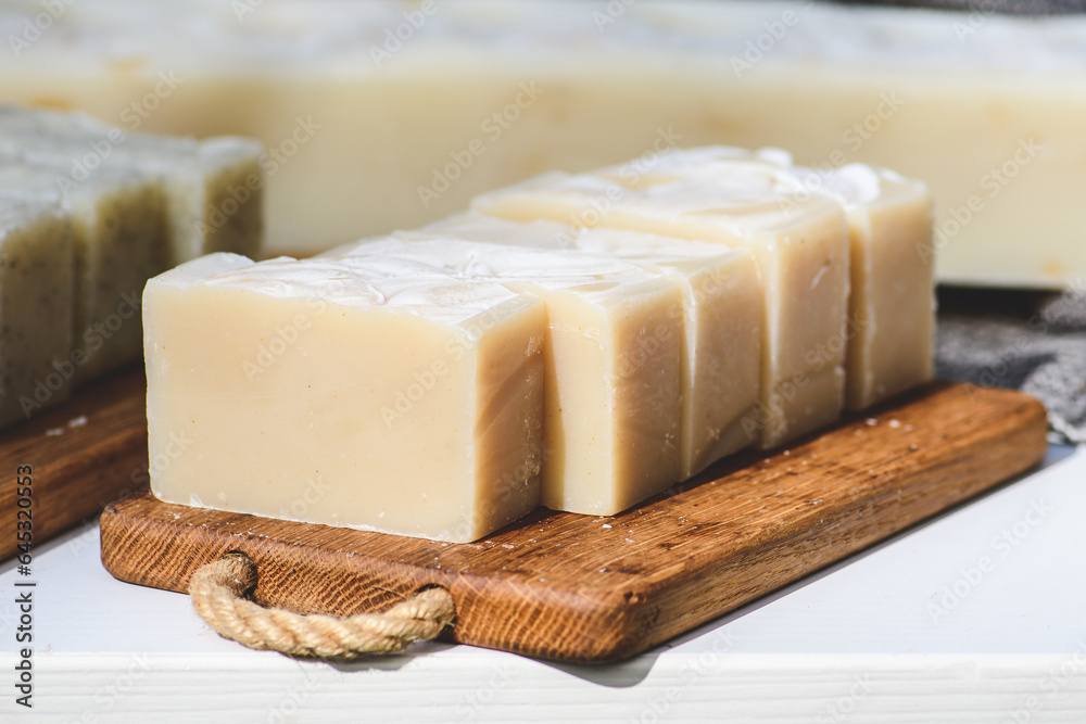 Organic handmade soap on a wooden board in a folk arts and crafts fair or market