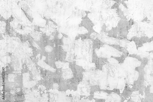 Gray concrete wall with white paint brush strokes, front view, texture