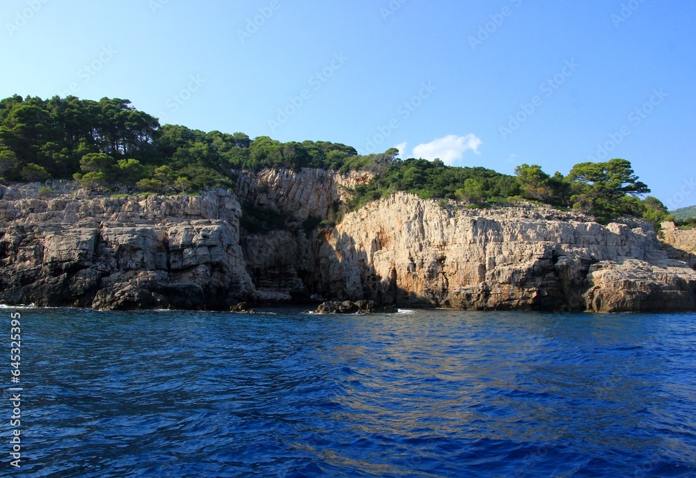 Lokrum island in the Adriatic Sea near Dubrovnik, Croatia. Beautiful blue water of the Adriatic Sea in the foreground